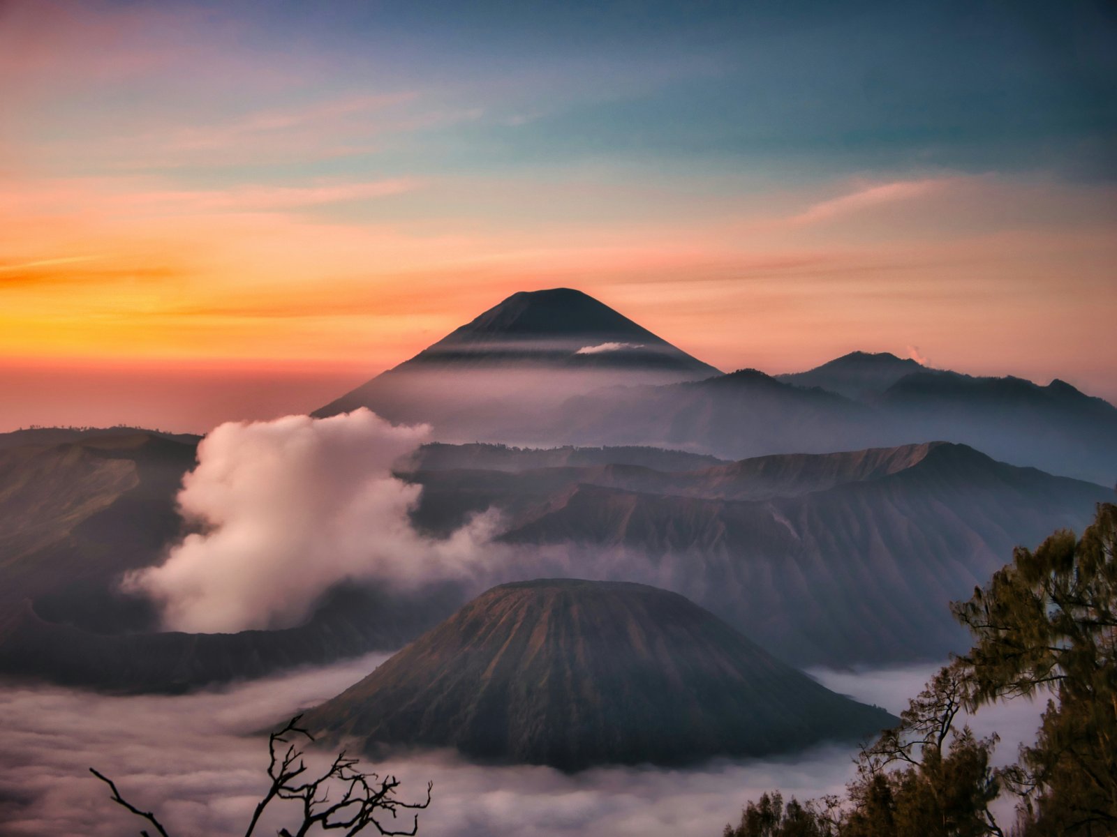 Sunrise over Mount Bromo with Mount Semeru behind